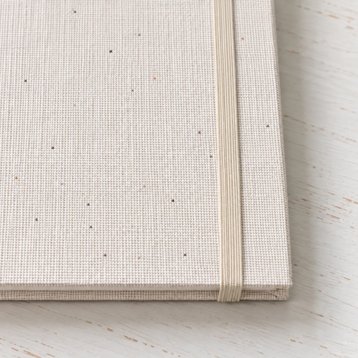 Close view of the woven cloth cover and cream elastic